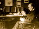 Max Planck seated at desk poster print artwork.