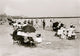 On the Beach at Coney Island Poster Print showcasing a vibrant beach scene.