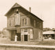 House with Flag in Asburg Park Poster Print showcasing a picturesque scene with an American flag.