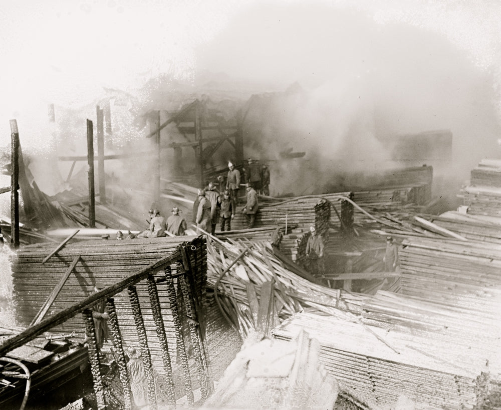 W.T. Galliher Fire in DC Lumber Yard Poster Print featuring firefighters surveying damage.