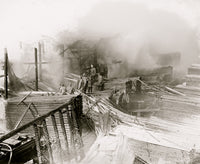W.T. Galliher Fire in DC Lumber Yard Poster Print featuring firefighters surveying damage.