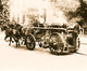 Three firemen on a fire engine drawn by three horses poster print.