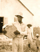 Man holding a drum on Cat Island poster print, vibrant artwork