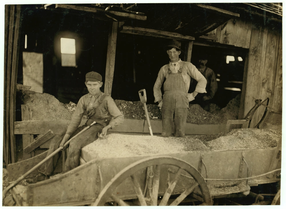 A Boy Shoveling Ore at Daisy Bell Mine Poster Print