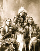 Poster of three young Indian men in native accessories, celebrating Sioux culture.