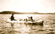 Five Ojibwa Indians Canoeing Poster Print featuring a man, woman, and three children.