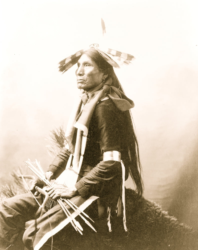 Good Eagle Indian Poster Print, three-quarter length, seated, holding bow and arrows.