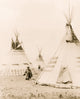 Woman walking among painted tipis poster print