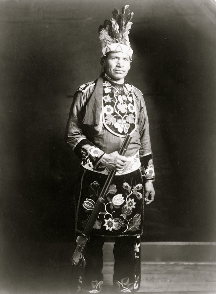 Ojibwa man full-length portrait poster print, standing with rifle.