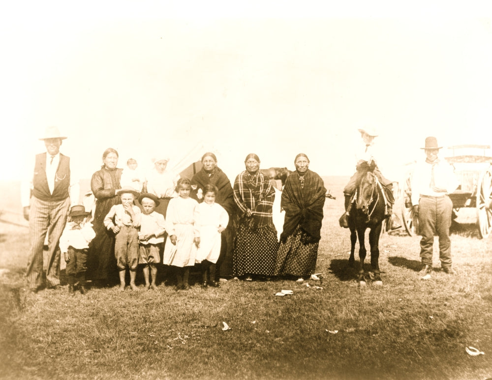 Kickapoo Indians standing outside a tent in Euro-American clothing poster print