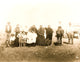 Kickapoo Indians standing outside a tent in Euro-American clothing poster print