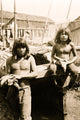 Poster of two young Indian men holding fresh produce, cultural art print.