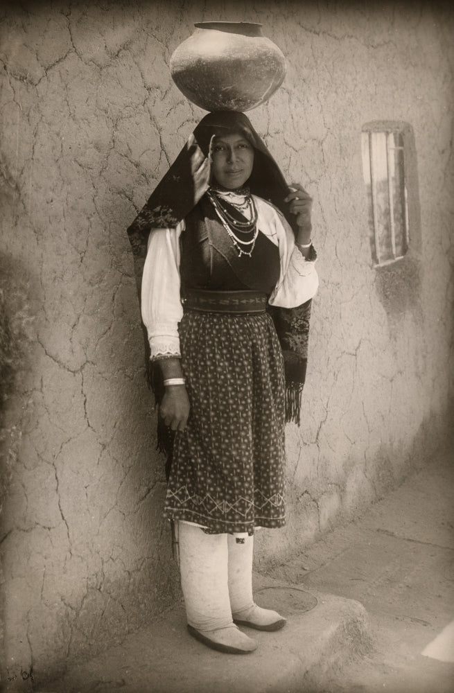 A Woman of the Isleta Pueblo Poster Print showcasing traditional Native American art.