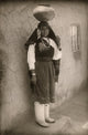 A Woman of the Isleta Pueblo Poster Print showcasing traditional Native American art.