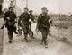 German Marines Carrying Wounded Poster Print showcasing bravery and resilience.