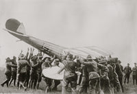 Righting an Overturned Plane Poster Print capturing the moment of a plane being righted.