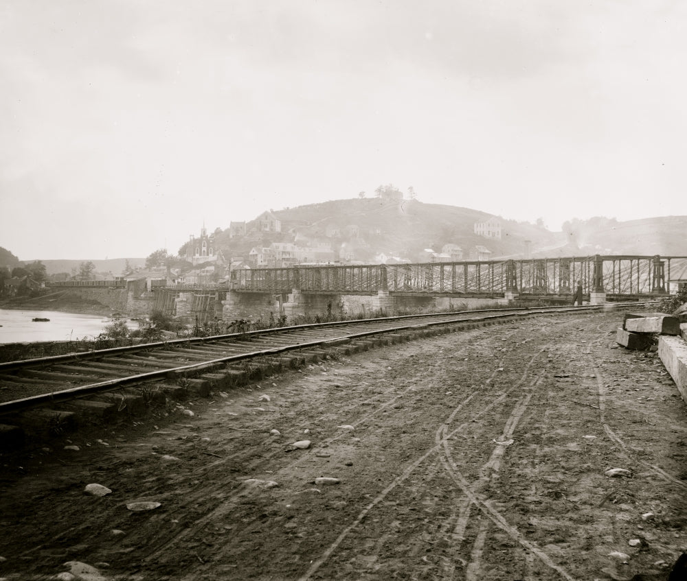 Harper's Ferry, W. Va. poster print featuring town view and railroad bridge.
