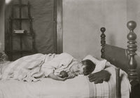 Boy Asleep in His Bed Poster Print featuring a baseball and glove.
