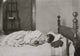 Boy Asleep in His Bed Poster Print featuring a baseball and glove.