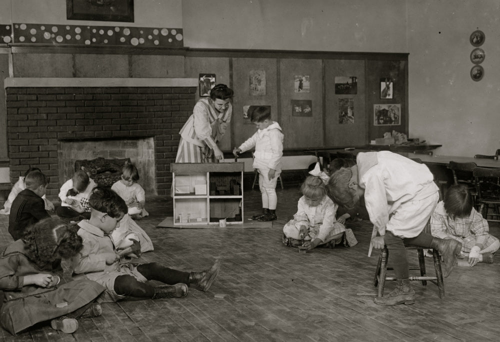 Kindergarten children at Horace Mann School working on doll houses poster print.