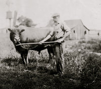Dairyman in Kentucky poster print featuring a farmer with a cow.