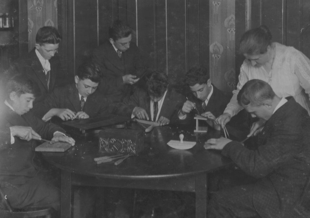 Wood Carving of Working Boys at King Philip Settlement Poster Print
