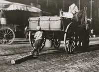 Boys hooking a log to a cart poster print.