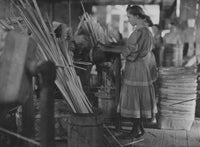 A Basket Factory poster print featuring girls making melon baskets