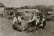 Three young farmers raising pigs poster print