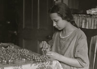 Cottage Industry Poster Print showcasing a young girl stringing material.