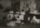 Stringing Wooden Buttons poster print depicting a family crafting scene.