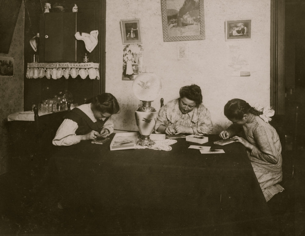 Brush-Making at Night Poster Print featuring two girls working on brush production late at night.