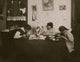 Brush-Making at Night Poster Print featuring two girls working on brush production late at night.