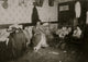 Mrs. Guadina's Struggle poster print depicting a mother in poverty working at home.