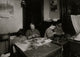 Making Roses in a Dim Kitchen Poster Print showcasing family dedication and artistry.