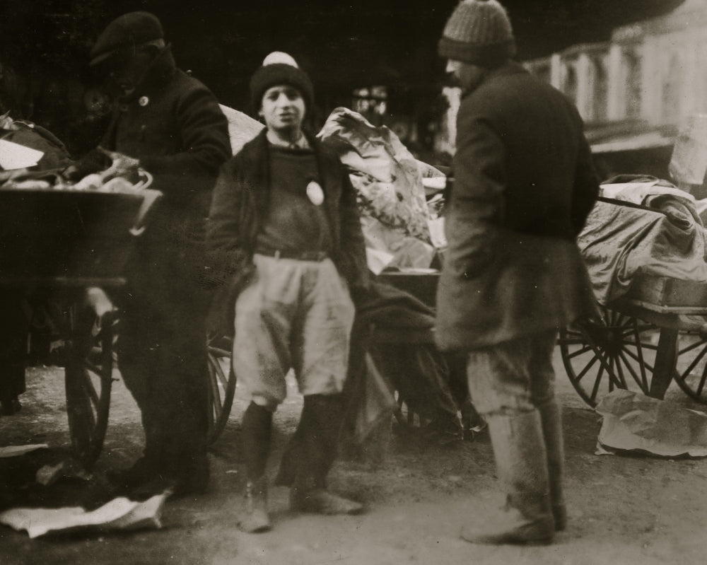 Young Vendor with Badge Poster Print showcasing youth and ambition.