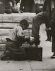 Bowery Bootblack Poster Print showcasing vintage urban charm.