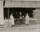 Young Market Vendors poster print featuring children at a vegetable stand.
