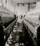 A Little Spinner at Mollahan Mills poster print showcasing a young spinner at work.