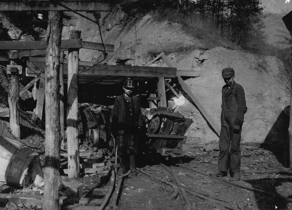 Hard Work and Danger Child Labor Poster Print showing a young boy in a coal mine.