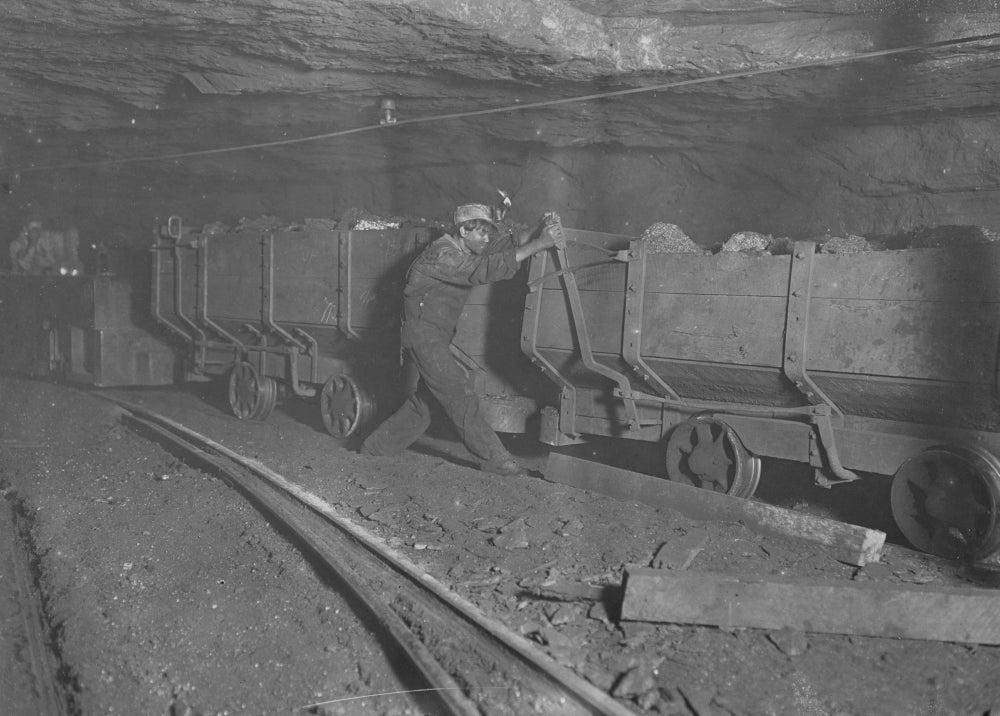 Boy Working on Motor Train Poster Print - Industrial Scene