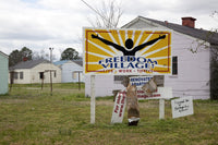 Cottages at Freedom Village Poster Print showcasing boarded up cottages in Montgomery, Alabama.
