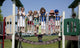 Children playing on a playground at Rise School in Tuscaloosa, Alabama poster print.