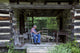 Basket Weaver in Log Cabin Poster Print showcasing a rural artisan.