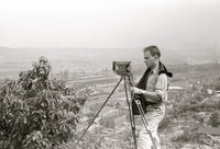 Cameraman Arthur Rothstein at Work Poster Print showcasing historic photography.