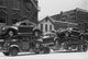 Autos on Transport Truck Piggyback Poster Print showcasing vehicles in transit.