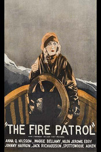 Fearful woman turning a ship's wheel poster print