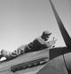 Marcellus G. Smith working on an airplane poster print