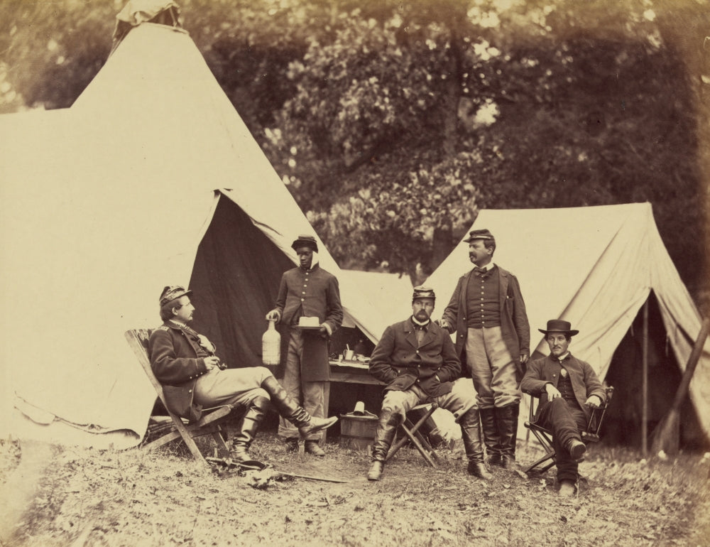 White soldier and young black servant poster print depicting soldiers by tents.