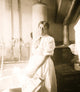 African American woman standing by a washtub with a washboard poster print.